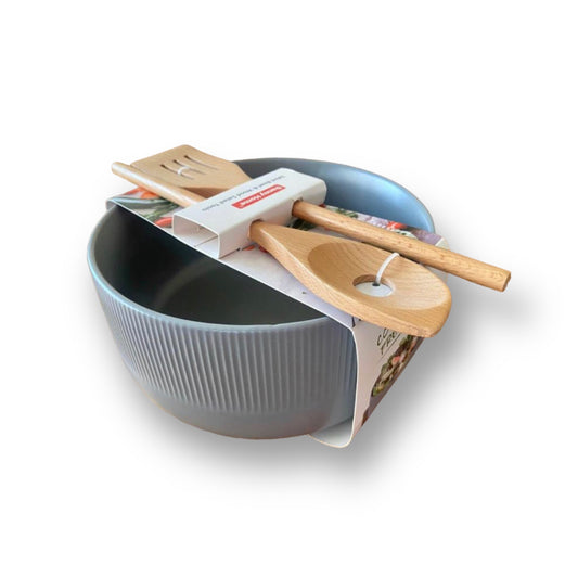 Salad ceramic bowl with wooden utensils